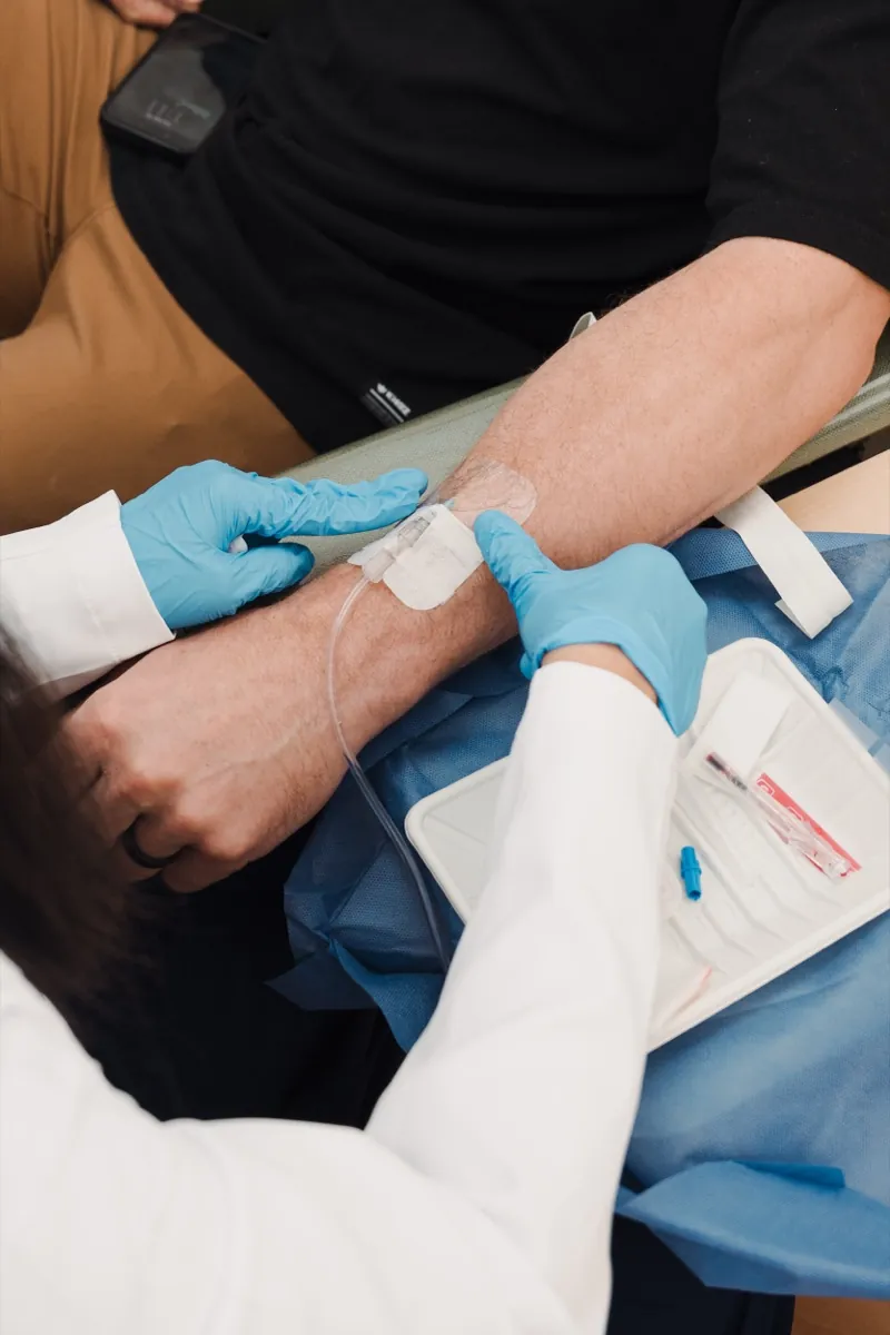 Clinician placing an IV line for an MSC infusion