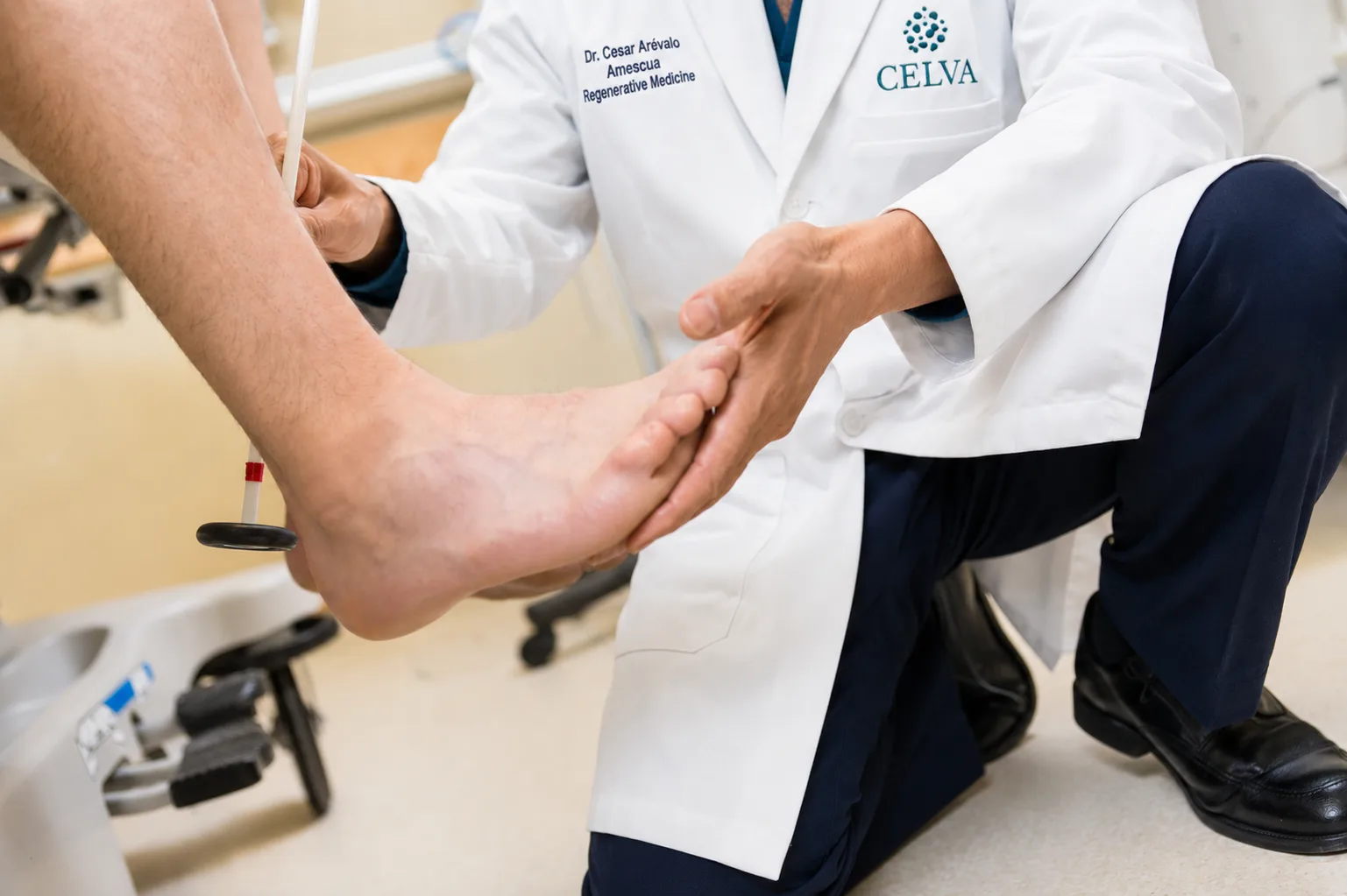 Celva physician examining a patient's foot for plantar and joint pain