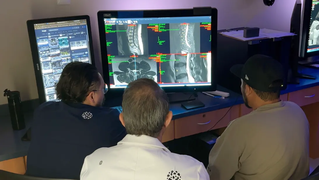 Ken and the physicians going over his MRI
