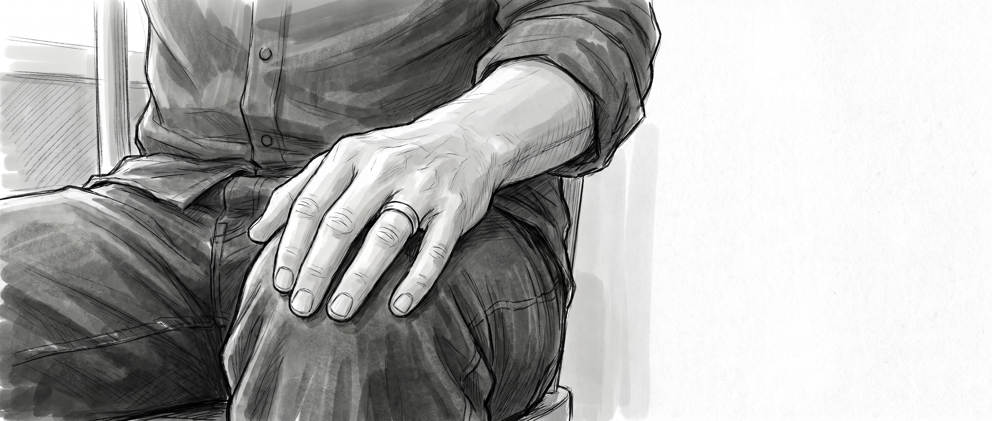 Hand resting on a knee, wedding ring visible.